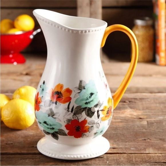 Floral Ceramic Pitcher with Orange Handle